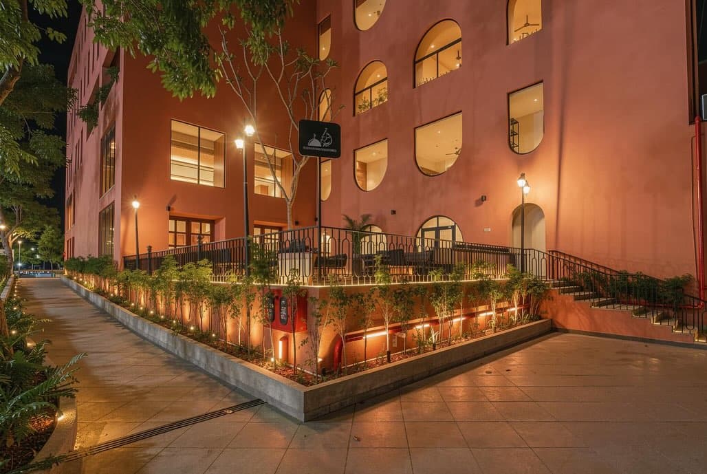 Open-air courtyard at Clarks Safari — terracotta facade and breakfast tables